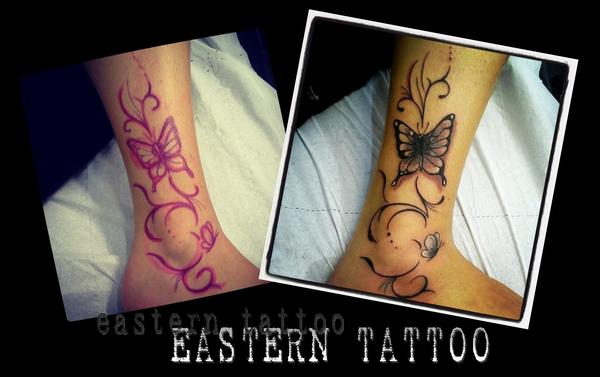 Photo de Arabesques et papillons, fleurs, tatouage réalisé par Eastern Tattoo