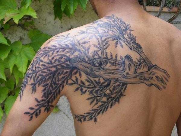 Photo de branche d'olivier, fleurs, tatouage réalisé par Eastern Tattoo
