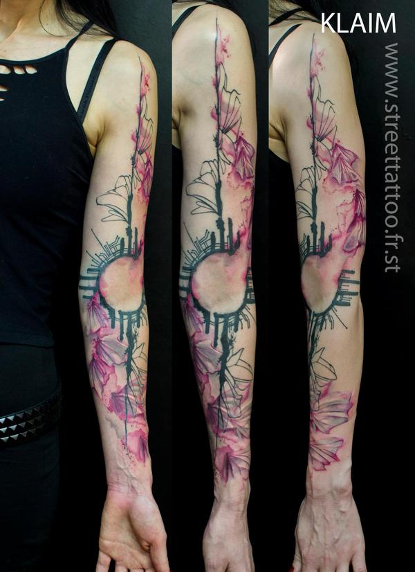 Photo de bras watercolor, tatouage, inclassable réalisé par Street Tattoo