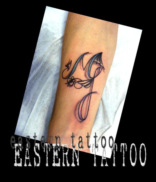 Photo de lettrage, lettrage, tatouage réalisé par Eastern Tattoo