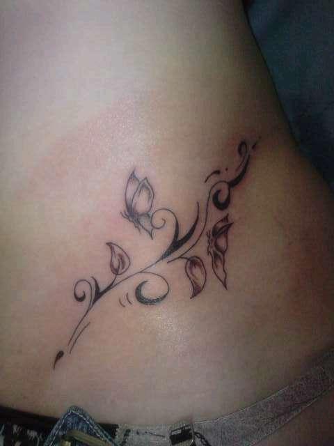 Photo de Papillon arabesque, arabesque, papillon réalisé par fantasy tattoo piercing